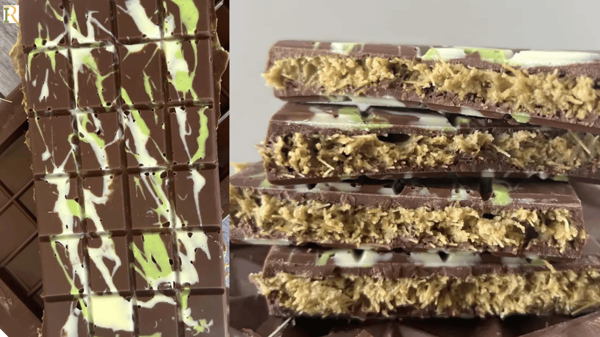 Close up of a sliced homemade Quick-Pistachio-Chocolate-Bar-Happy-Treat showing its green pistachio and crunchy golden vermicelli filling, resting on a light grey quartz countertop under natural light.